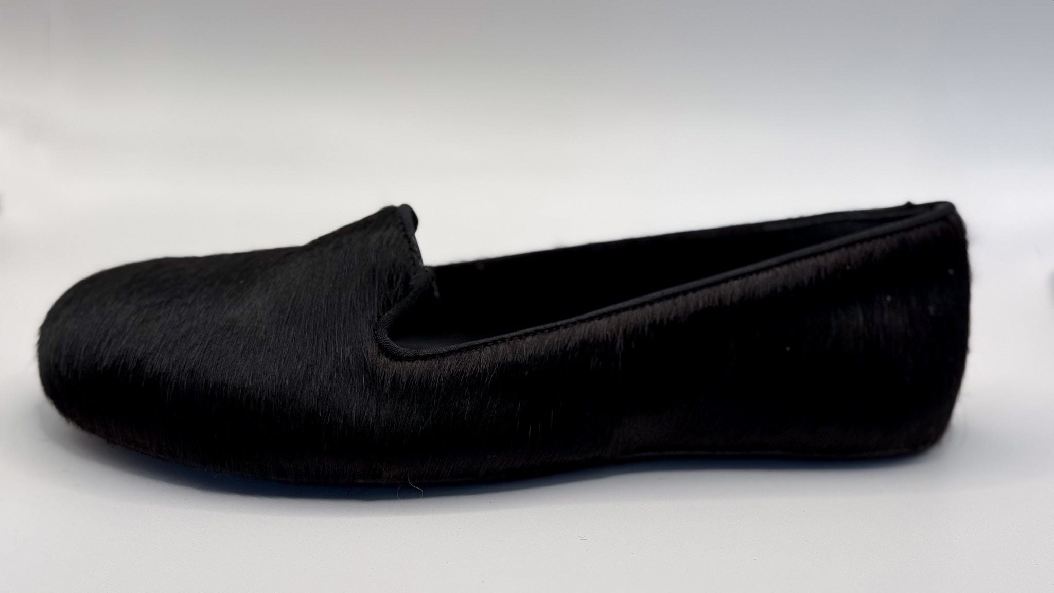 Black slipper on a white background